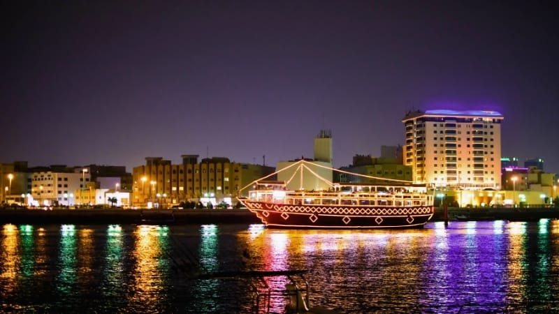 Indian couple enjoying romantic dinner on Dubai Marina dhow cruise